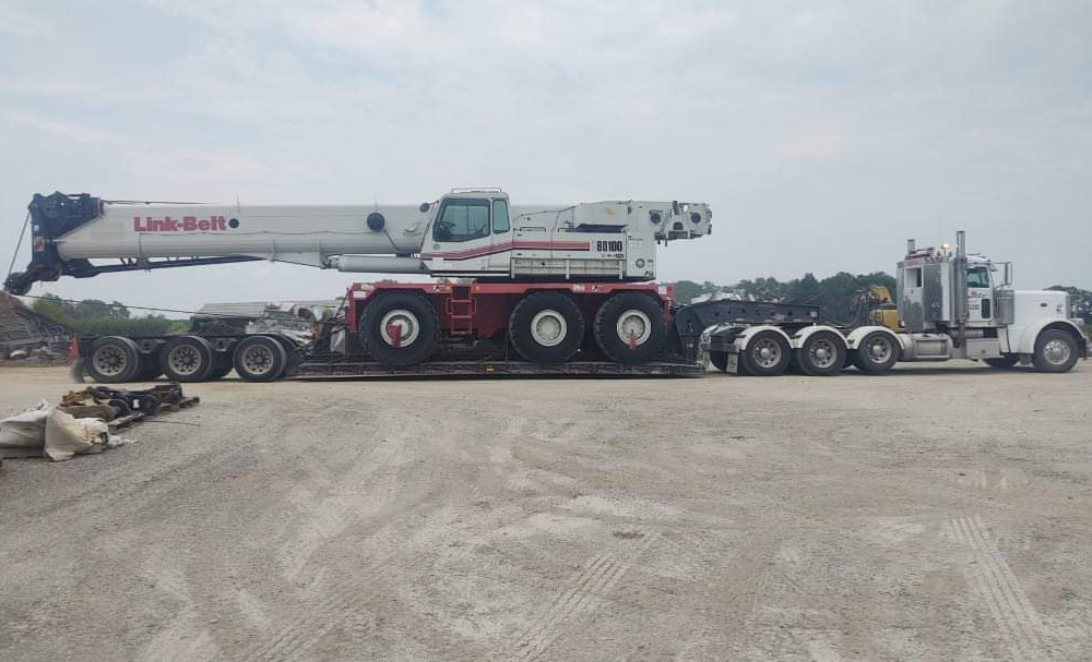 A large crane is parked on the road.