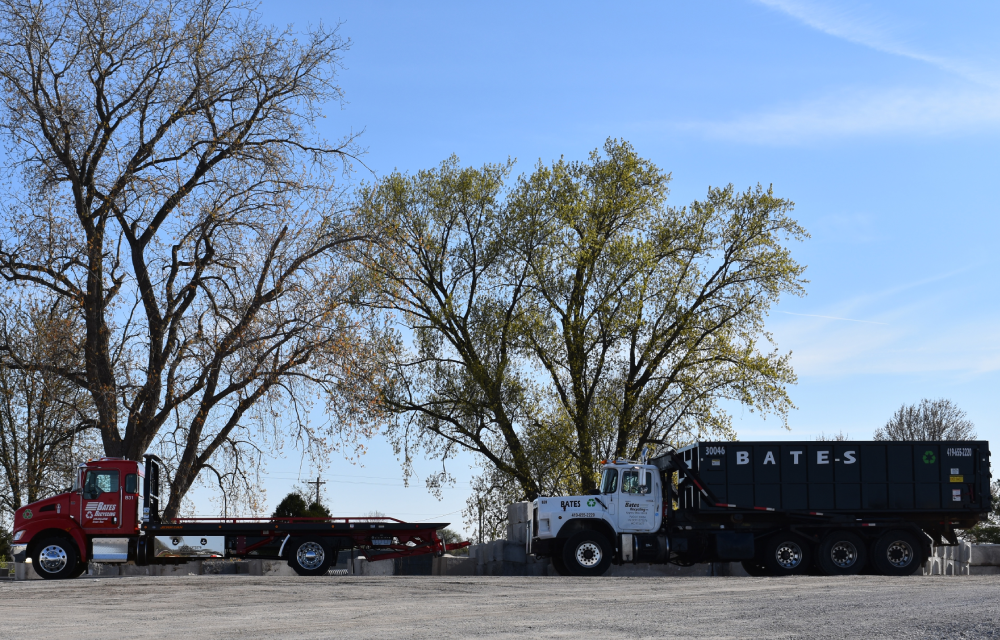 A truck and trailer parked in the parking lot.